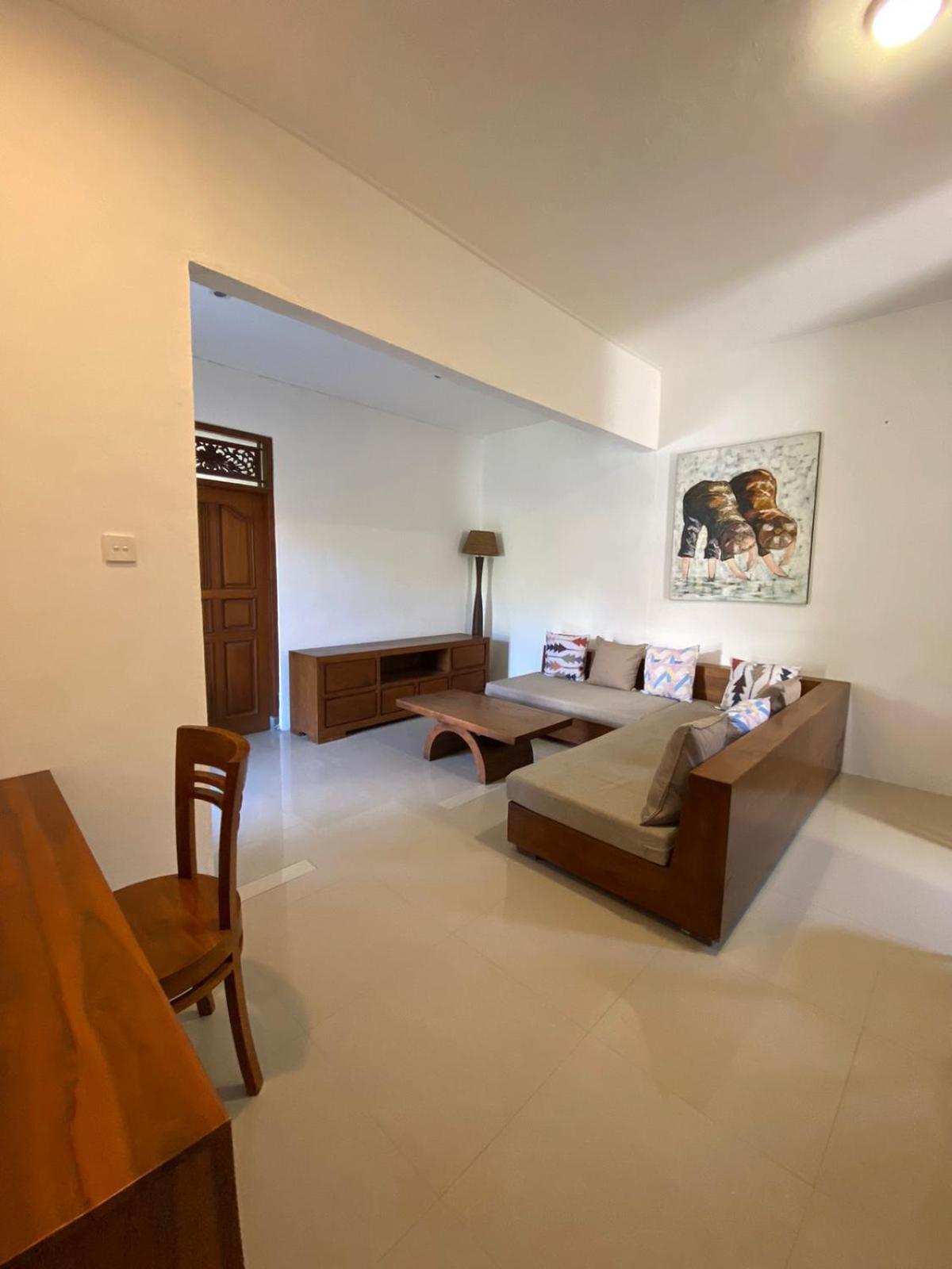 Adore Guesthouse Amed Habitación foto