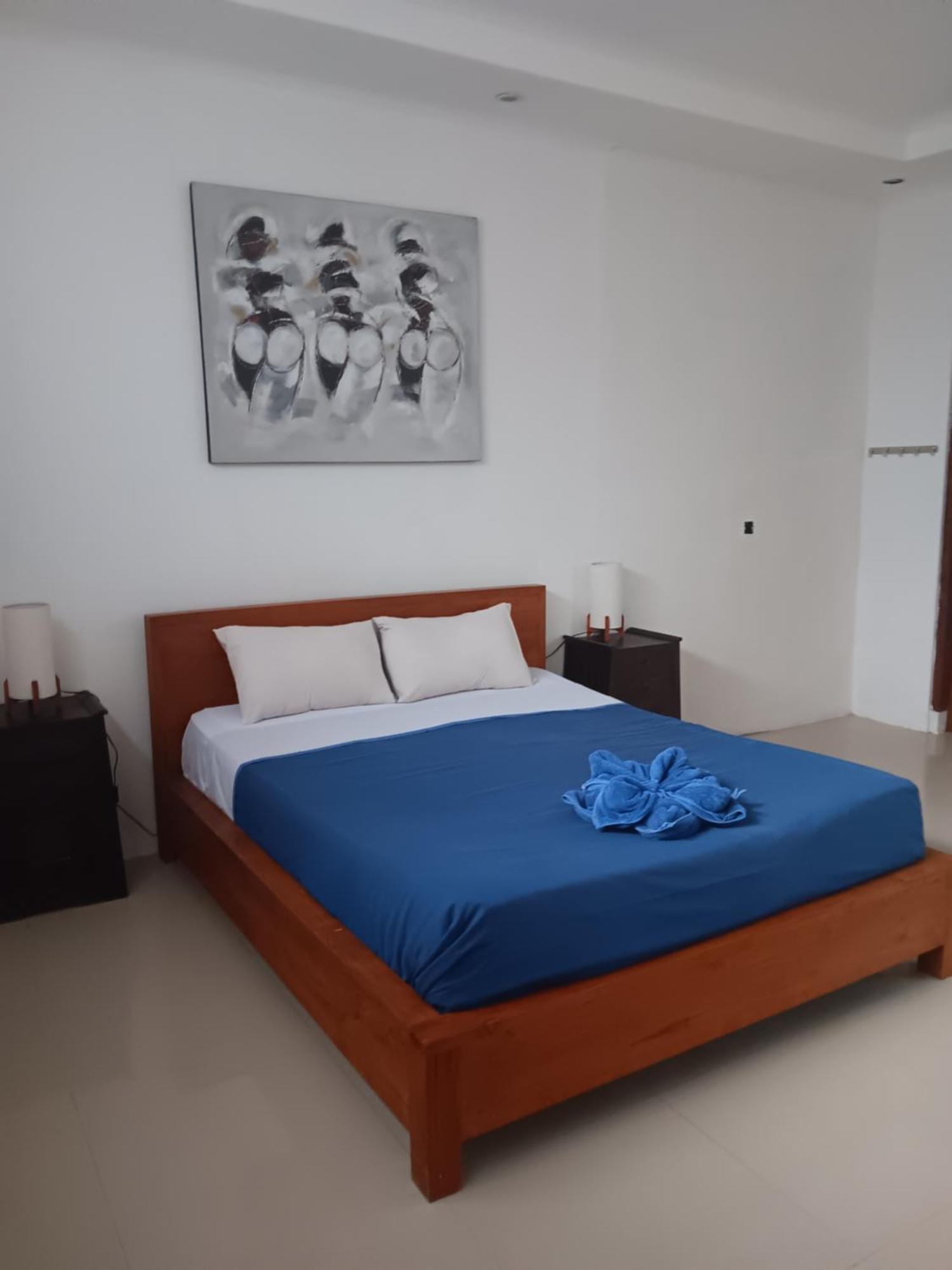 Adore Guesthouse Amed Habitación foto