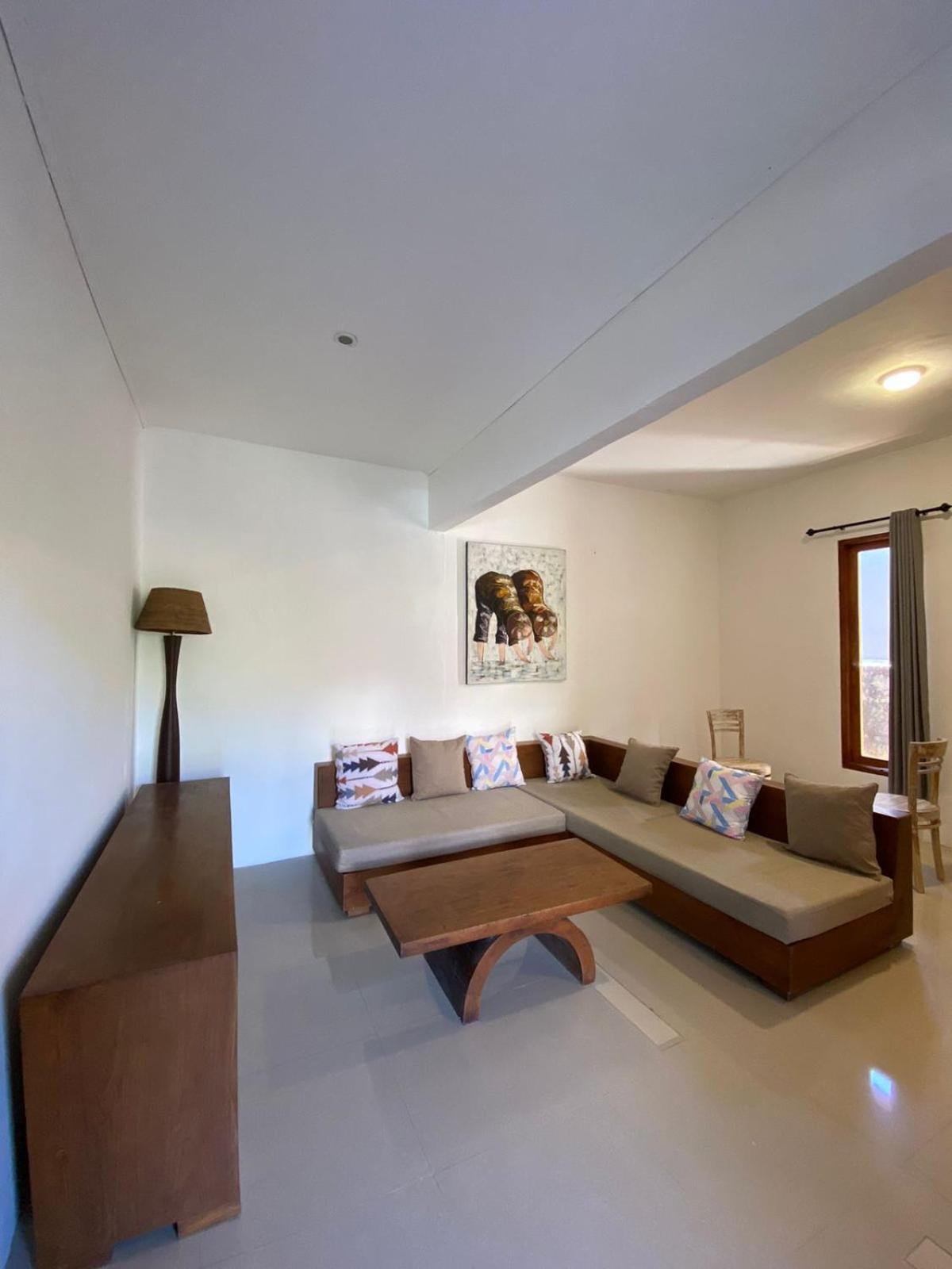 Adore Guesthouse Amed Habitación foto